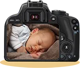 SLR camera with a photo of a baby on the display